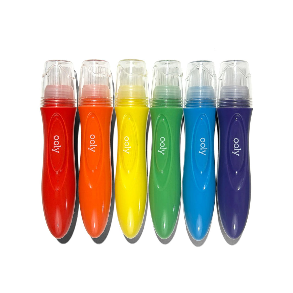 Set of six colorful ooly markers on a white background