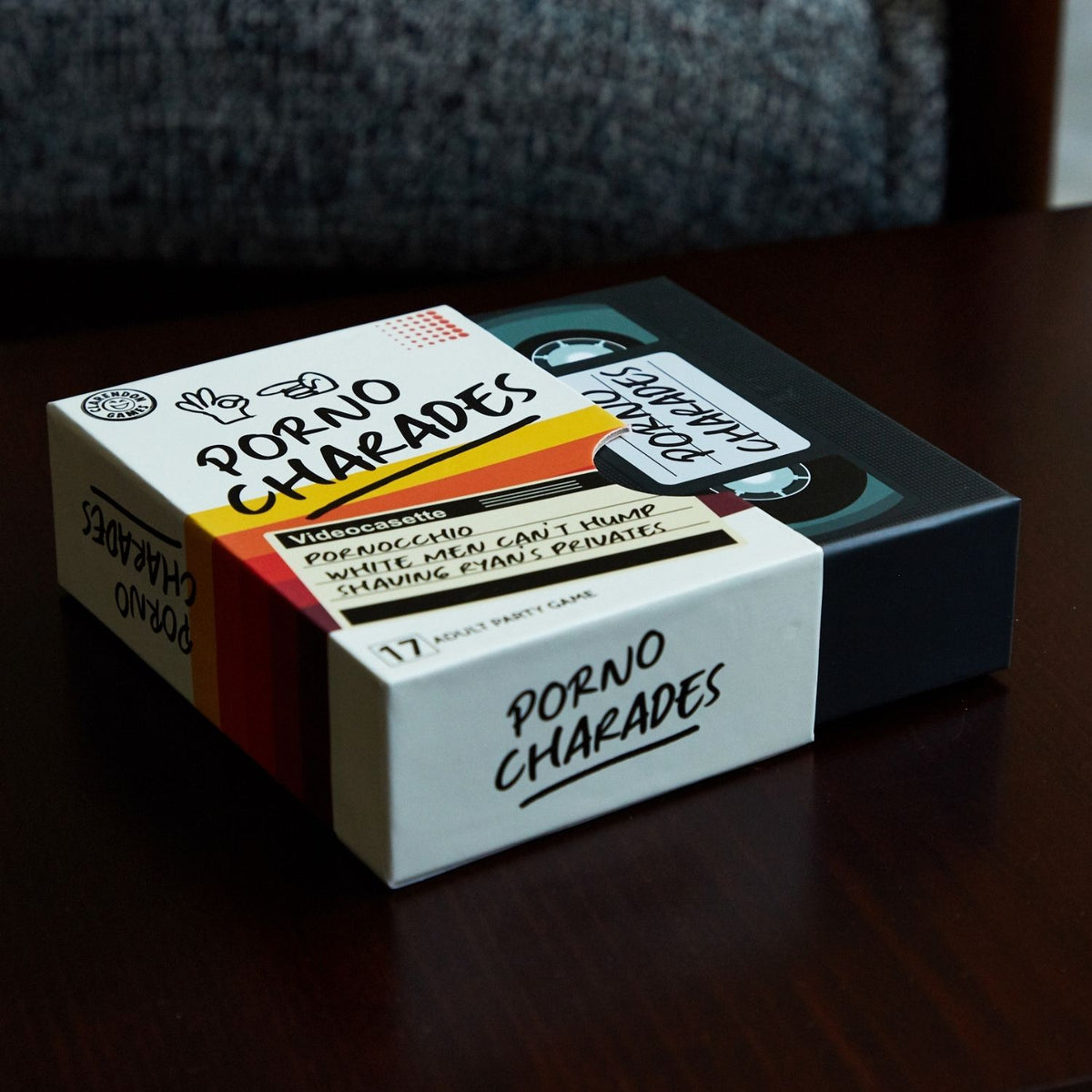 Box of 'Porno Charades' game on a dark surface