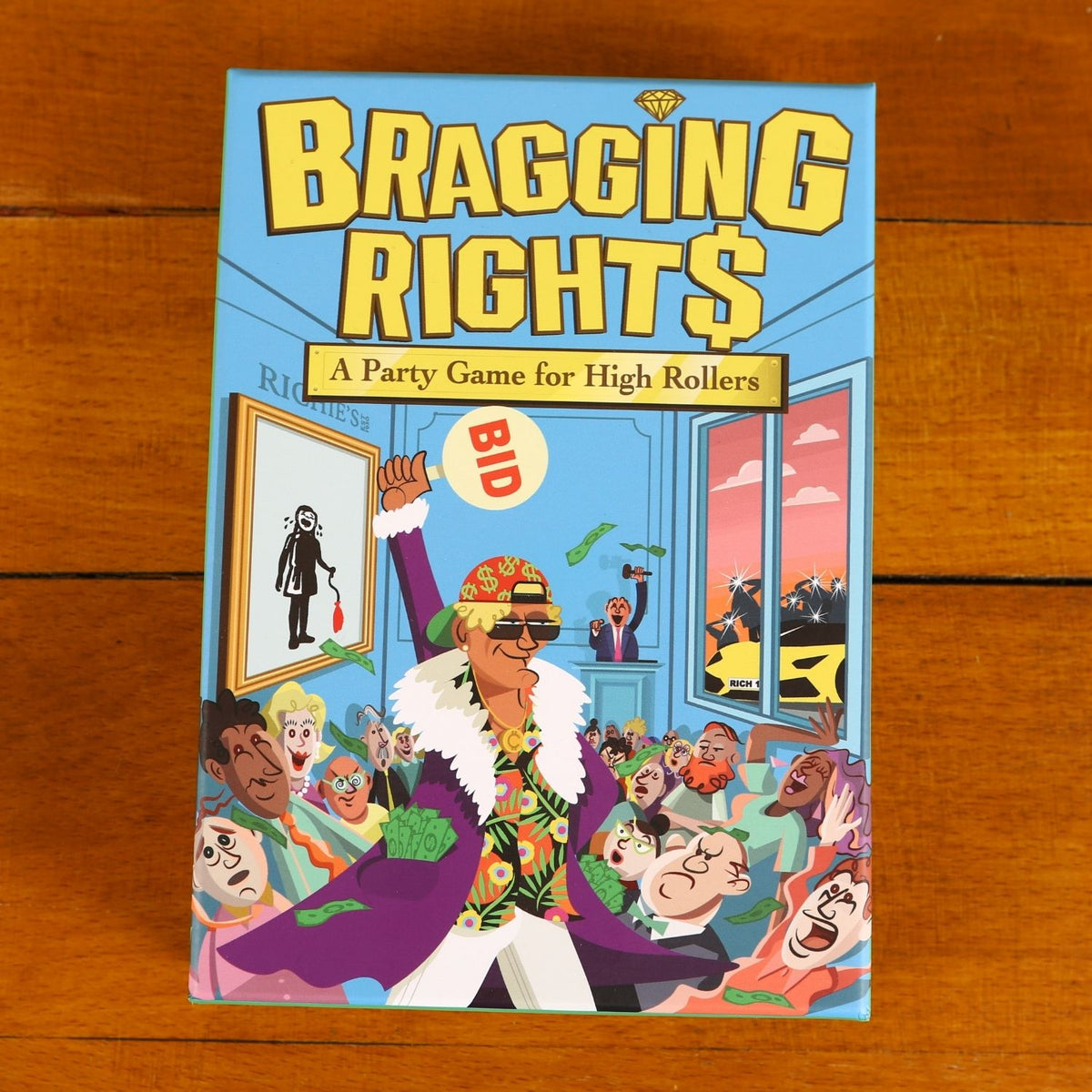 Board game box titled 'Bragging Rights' on a wooden surface