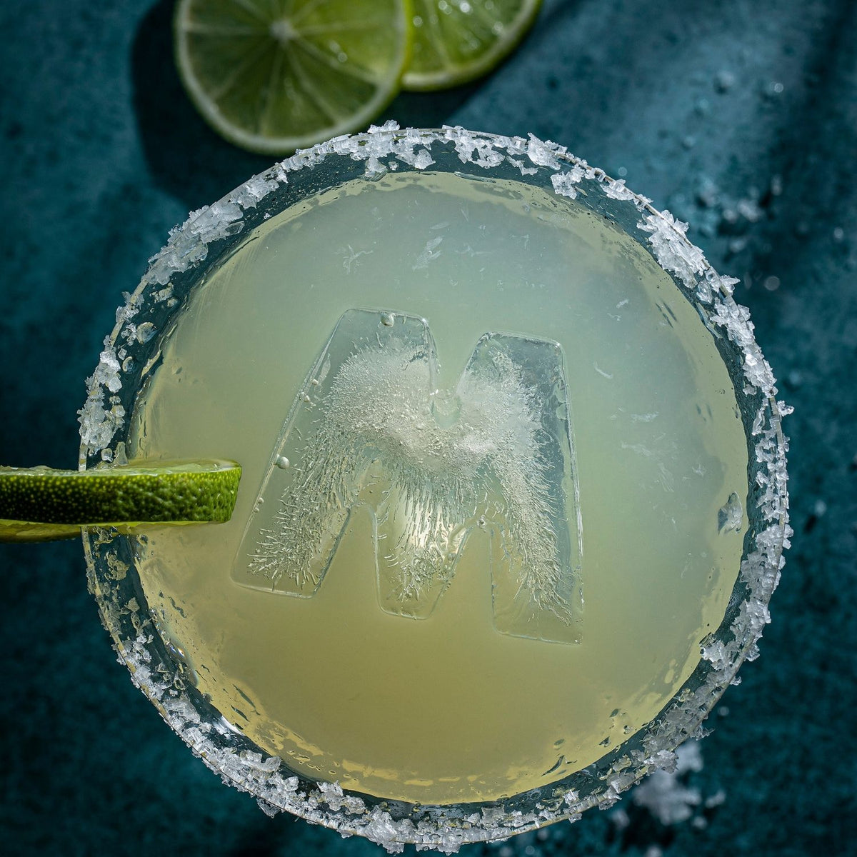 'M' prsonalised letter ice tray mould creating monogram ice cubes for cocktails and entertaining.