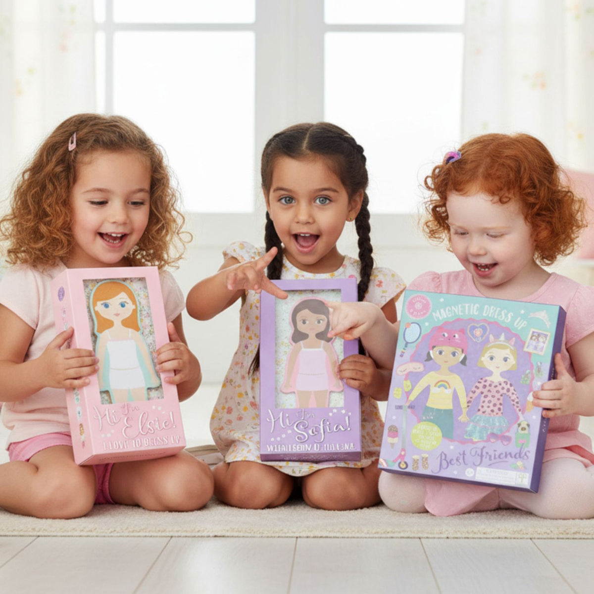 Children holding magentic dress up dolls 