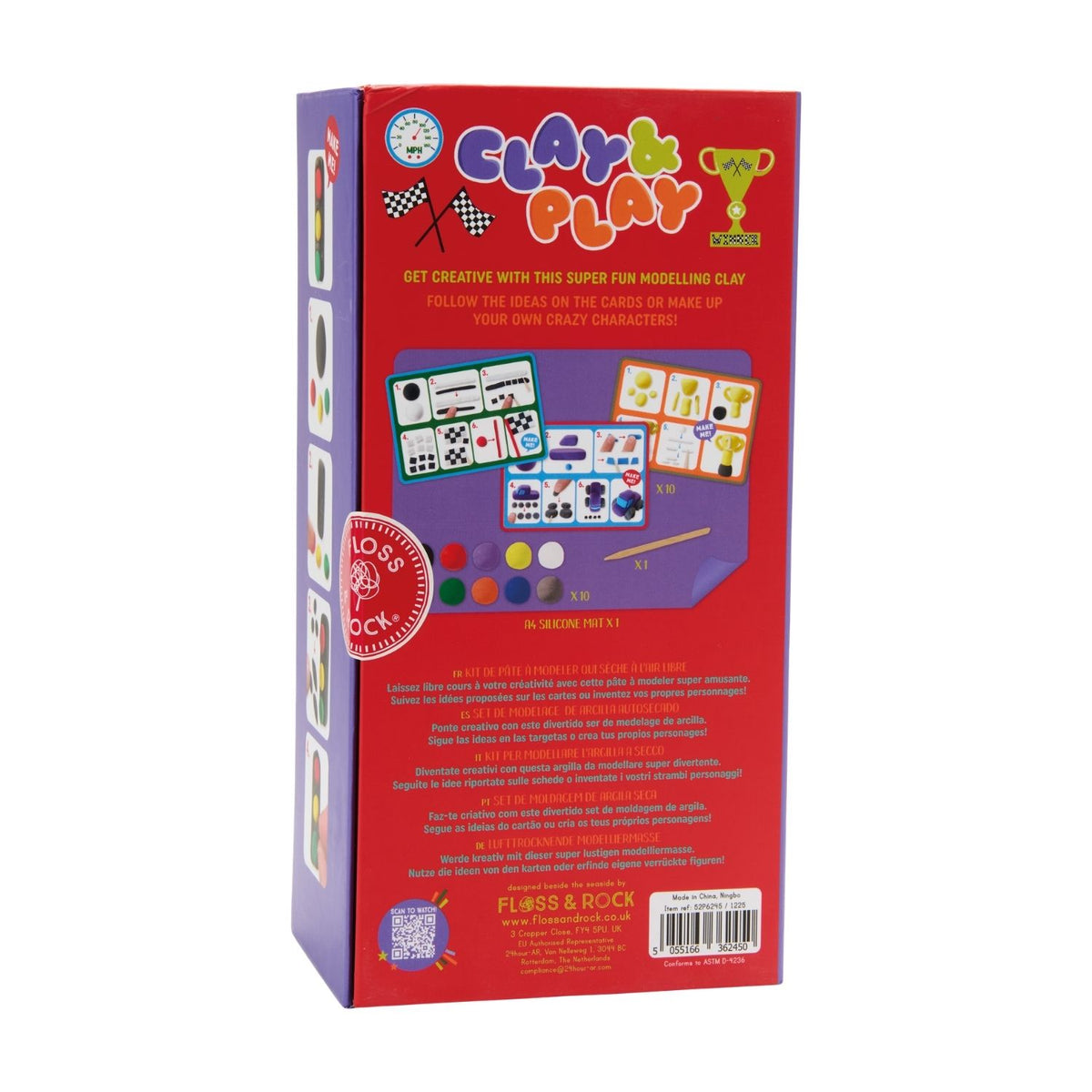 The reusable product box unfolded to reveal a vibrant city and racetrack play scene with finished clay cars and traffic accessories displayed inside.