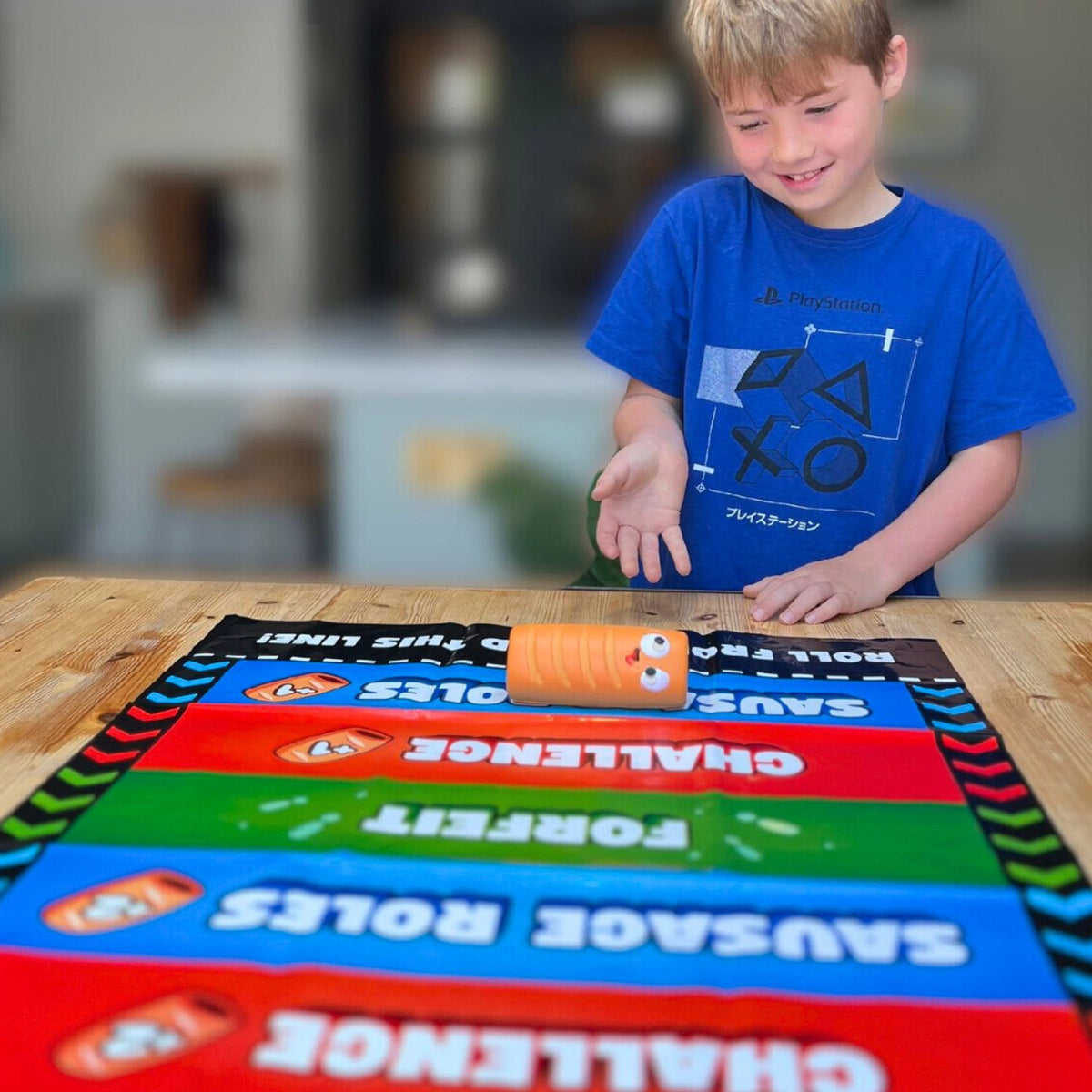 Child playing with a colorful game board showing the durable, wipe-clean runway mat, highlighting the vibrant scoring zones and the portable, roll-up design.