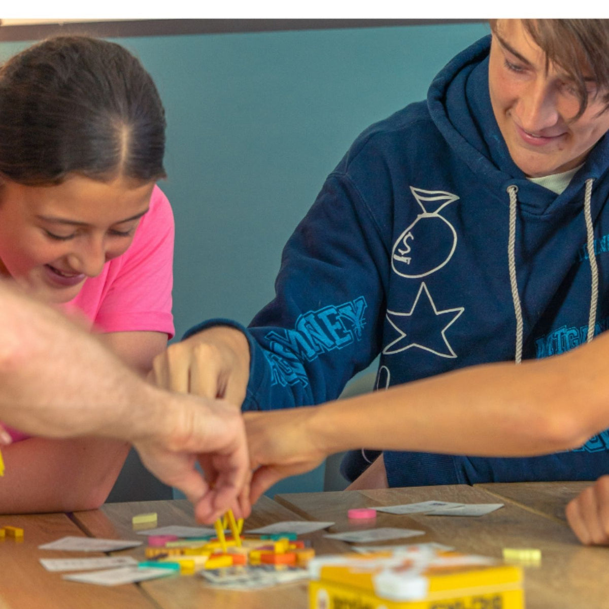 A group of people playing Beaks together at a table.