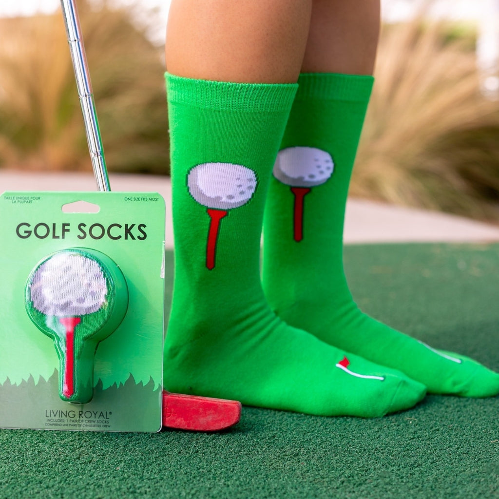 A fun lifestyle photo of someone at a driving range wearing the 3D golf socks while holding a golf club