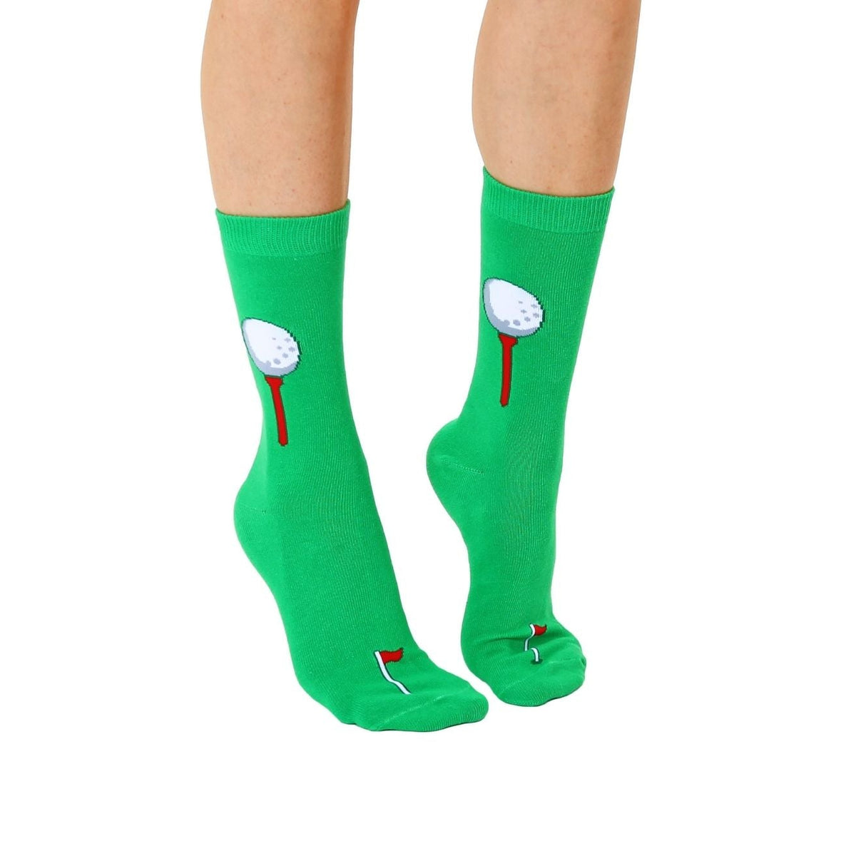 Green socks with golf ball and flag design worn by a person on a white background