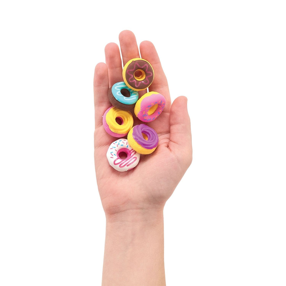 Colorful donut-shaped erasers held in a hand 