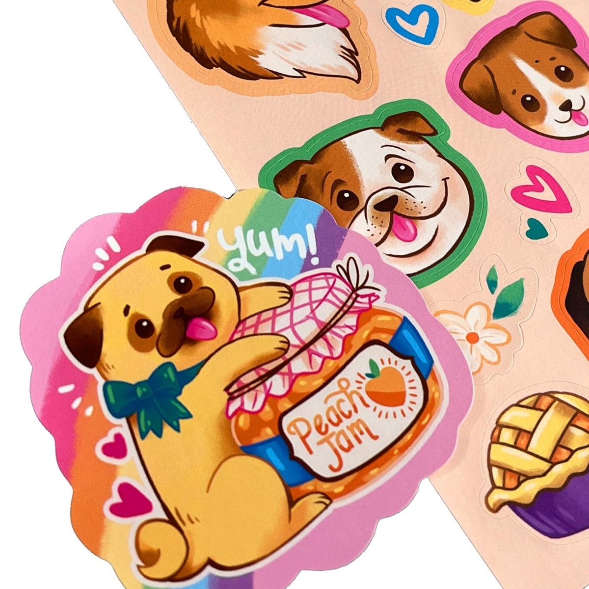 Sticker sheet with cartoon dog holding a peach jam jar and 'Yum!' text, surrounded by colorful hearts and flowers.
