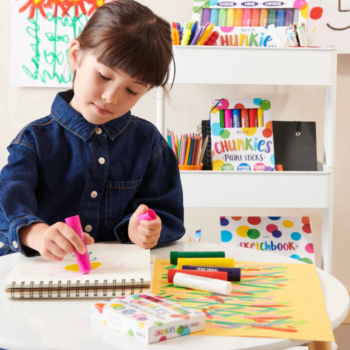 a young child’s hand comfortably grasping the thick barrel, illustrating how the design supports fine motor skill development.