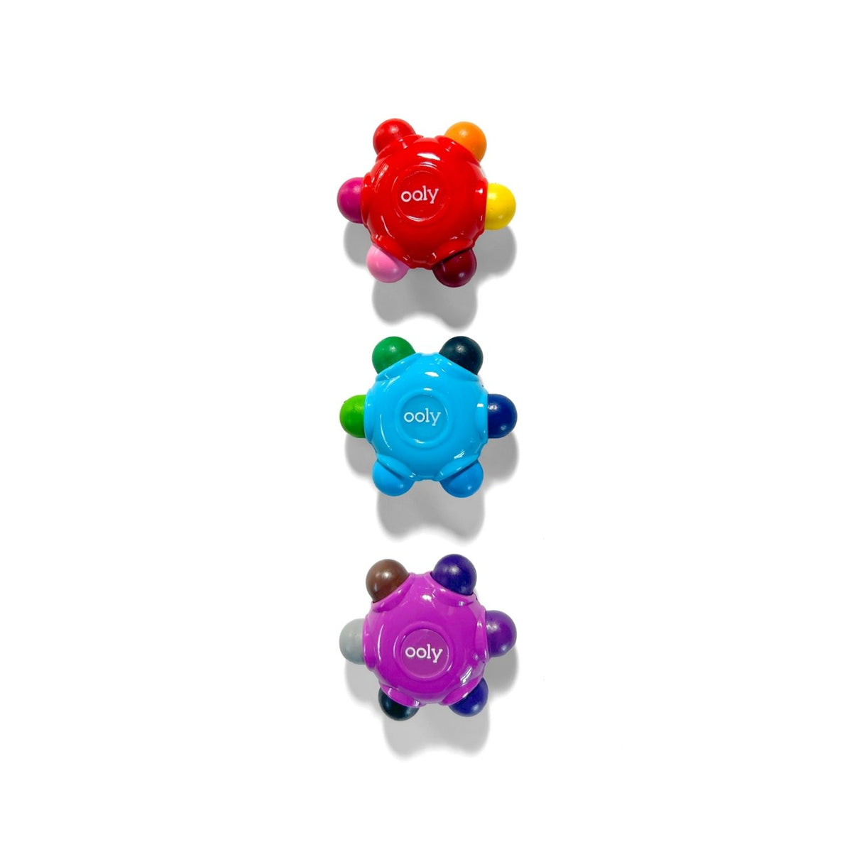 A top-down shot of the three flower crayons, showcasing the sturdy, break-resistant shape and the bright, non-toxic wax.