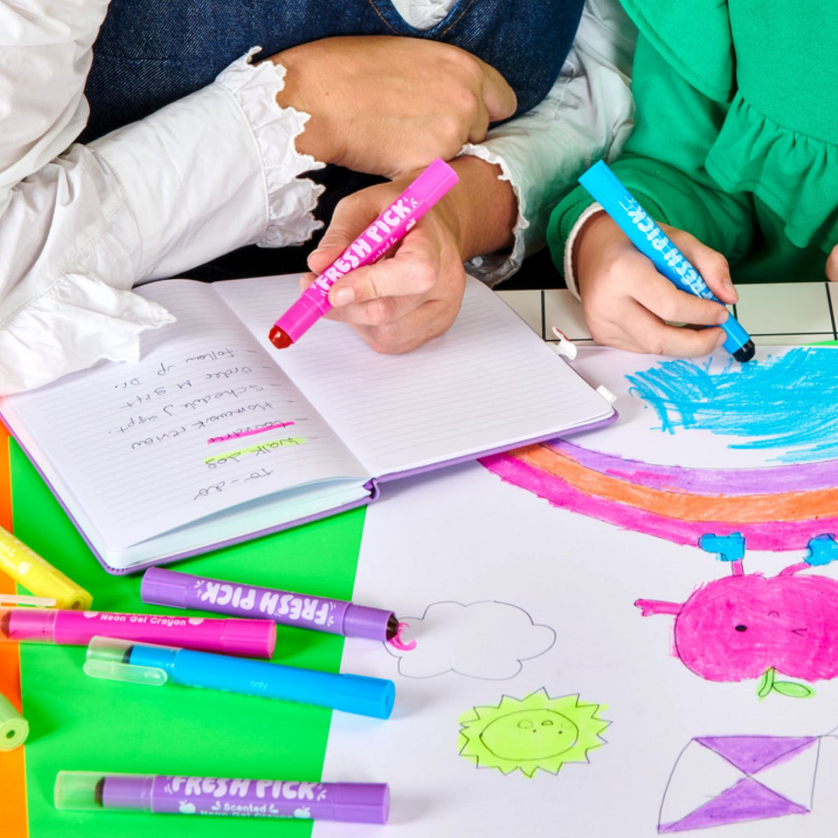 A close-up of the neon green gel crayon being used on a planner, showcasing the smooth, buttery application and bold transparency.