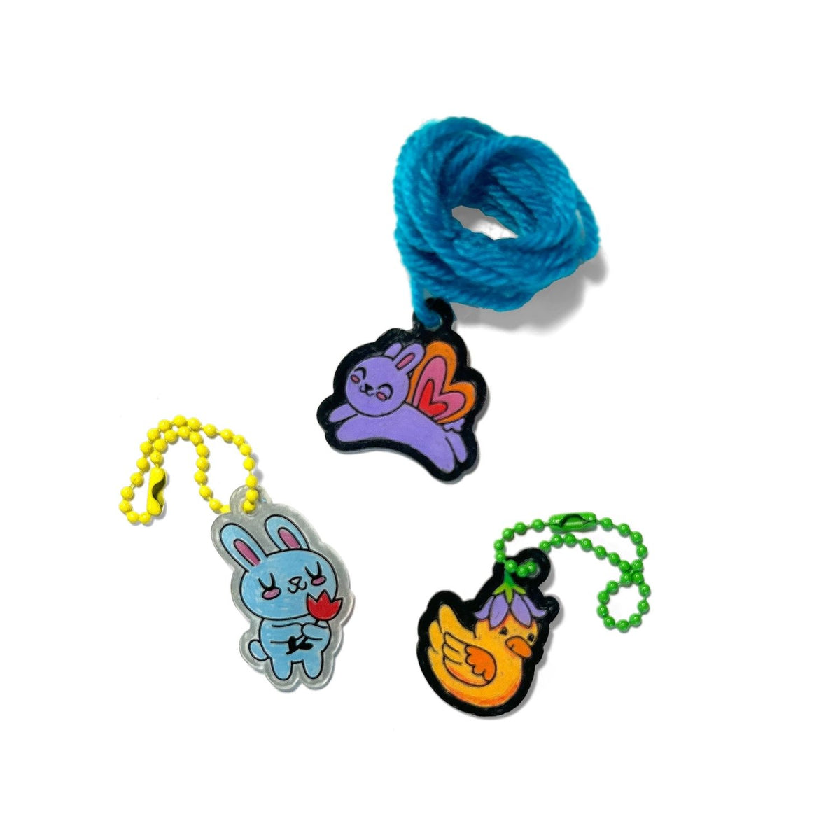 A collection of finished charm in different colours, showcasing the variety of charms kids can create for friends.