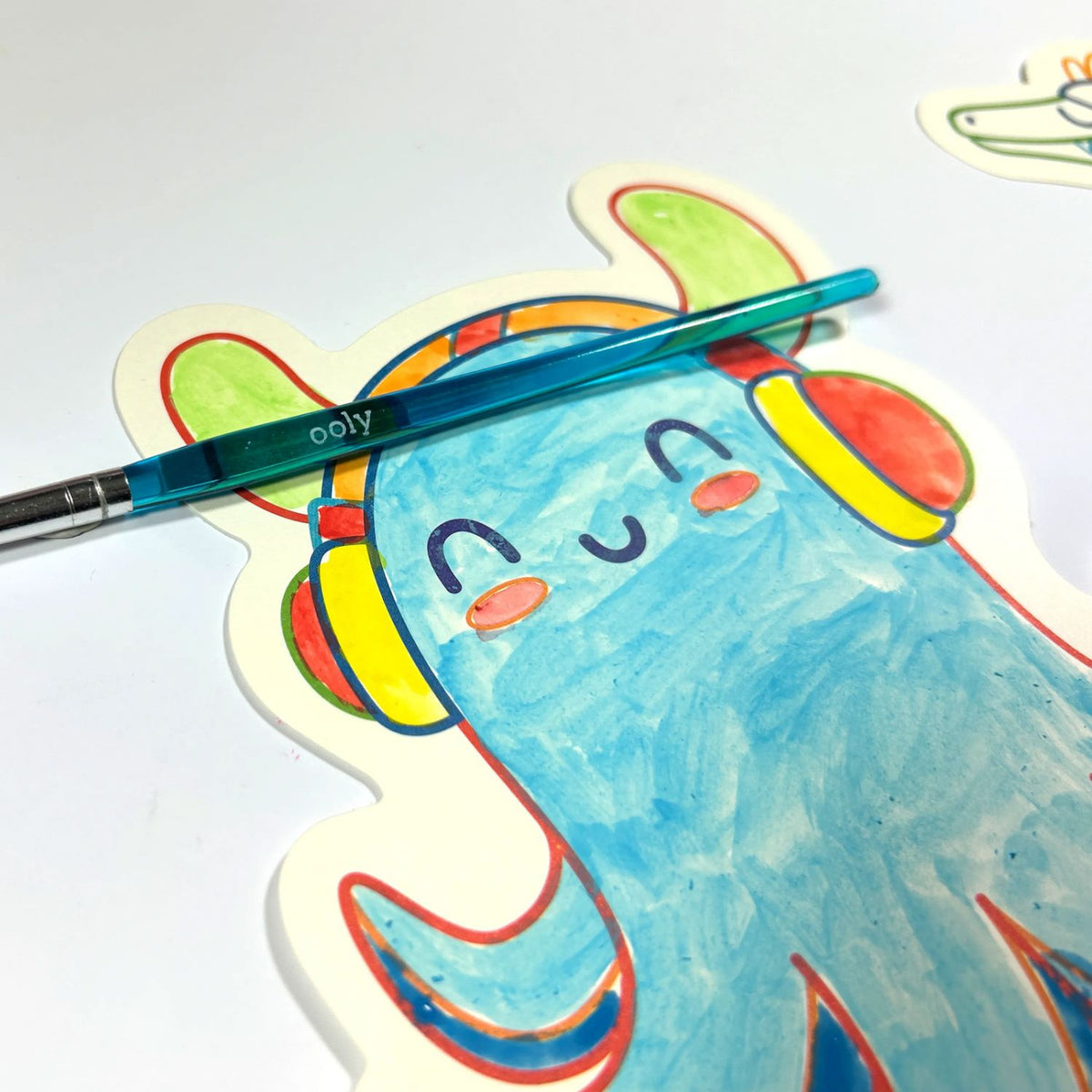 Colorful drawing of a cartoon character with a pen on a white background