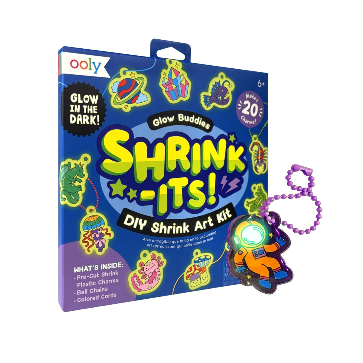 The Shrink-Its! Glow-in-the-Dark Buddies Art Kit featuring vibrant packaging, the shrink sheets, and colourful keychain accessories.