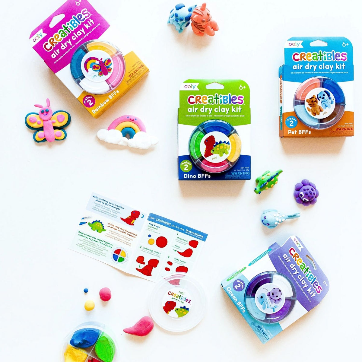Collection of OOLY Creatibles air dry clay kits and molded clay animal creations