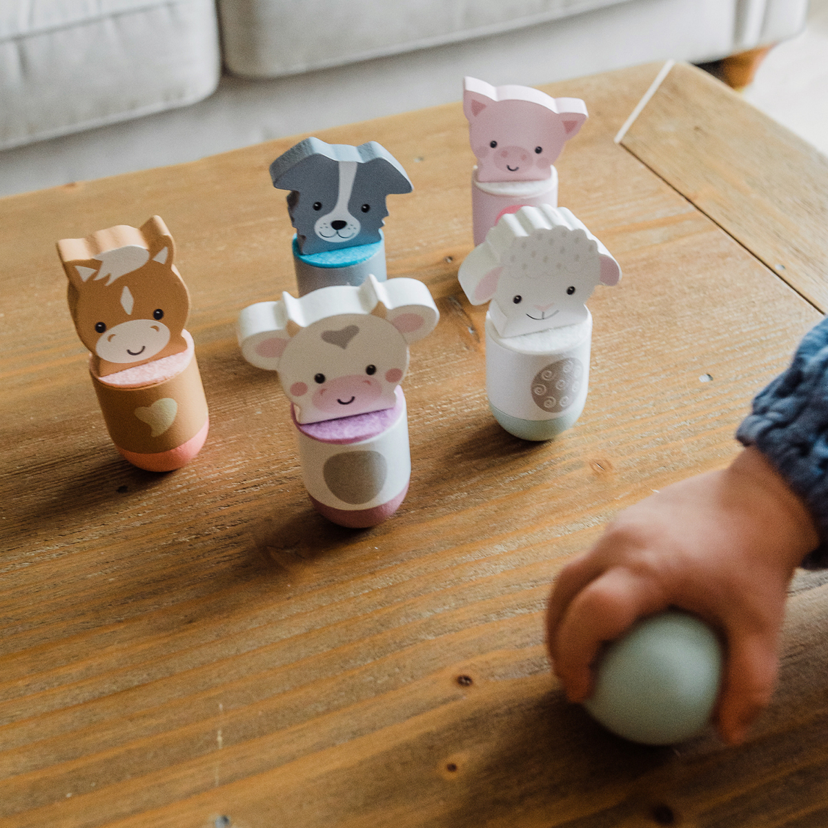Line them up and bowl! The Orange Tree Toys Farmyard Animal Skittles set includes 5 cute wooden animal pins and a ball to build gross motor coordination. Ages 3+.
