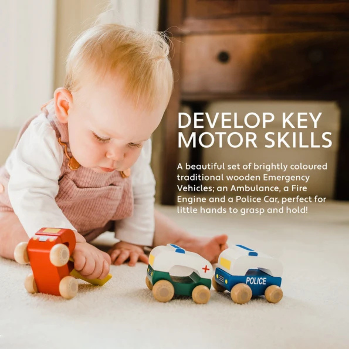 A shot of a toddler’s hand pushing the bright red wooden fire engine across the floor, demonstrating grip strength and fine motor play.