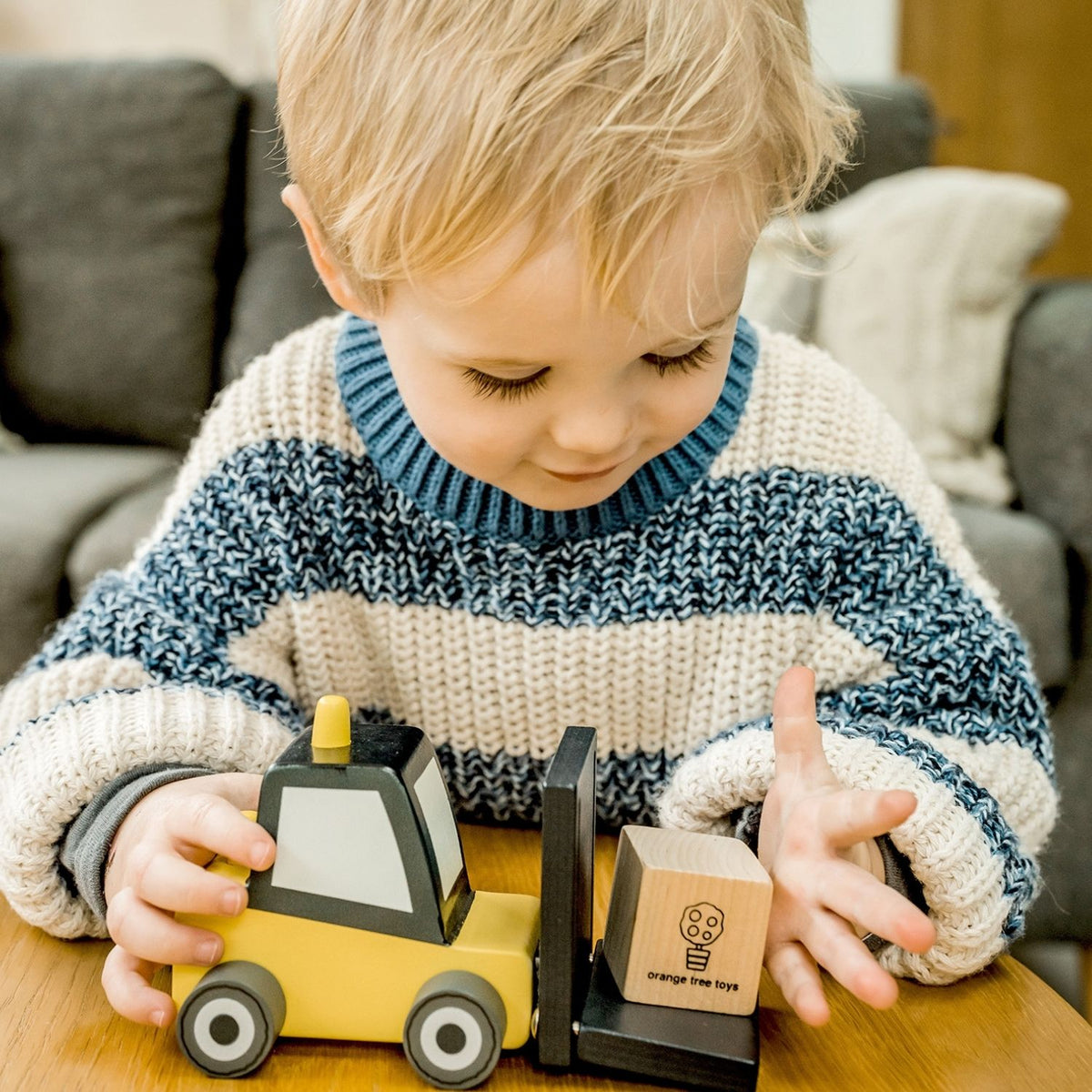Heavy-duty warehouse play! Crafted from durable solid wood with non-toxic paints. Sized perfectly for little hands to hoist cargo and maneuver across the floor.