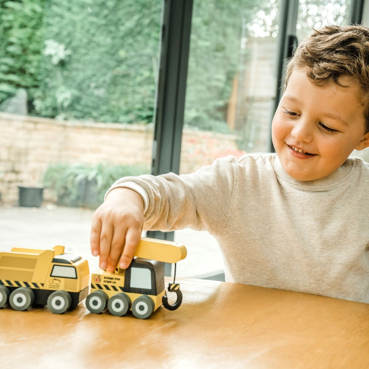 Heavy-duty worksite fun toys! Crafted from durable solid wood with non-toxic paints. Sized perfectly for little hands to steer, load, and maneuver across the floor.