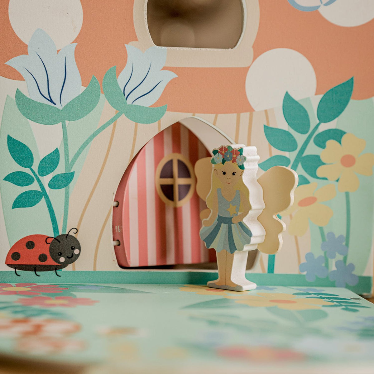 a close-up shot capturing the smooth wooden toys and playset components. 