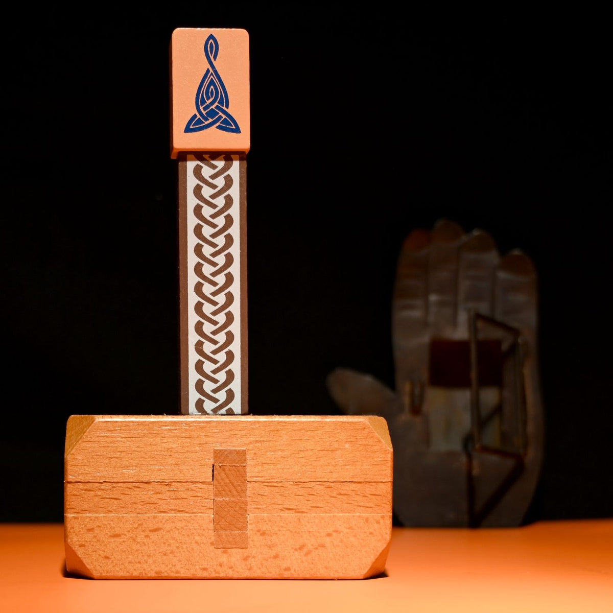 A 3D wooden Thor’s Hammer puzzle featuring a detailed handle and a large, interlocking mallet head inspired by Viking mythology.