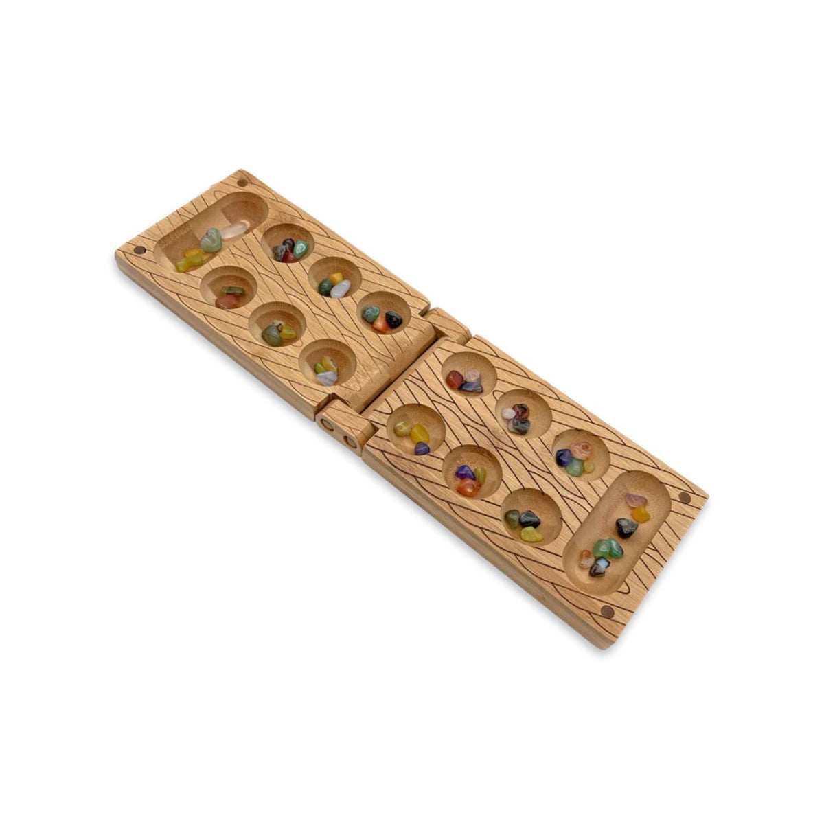A folding bamboo Mancala board shown open, displaying two rows of circular pockets filled with colourful polished stones for ages eight plus.