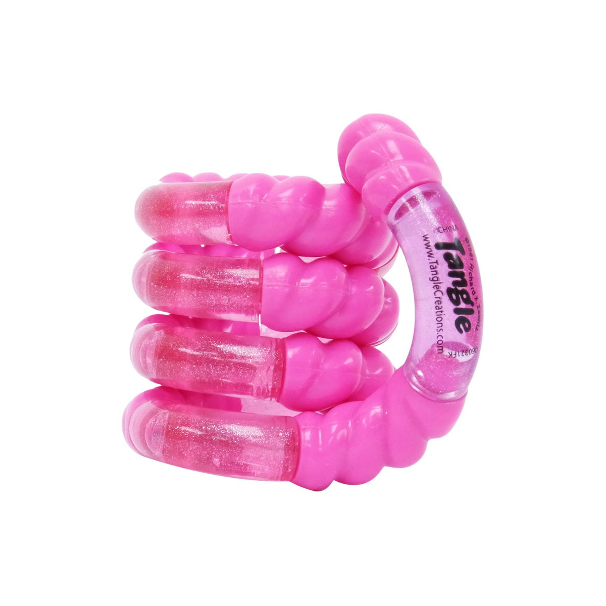 A Tangle Crush toy in the Soda Pop colorway twisted into a neat loop, showcasing its deep translucent pink plastic filled with shimmering pink and silver "crushed" glitter.