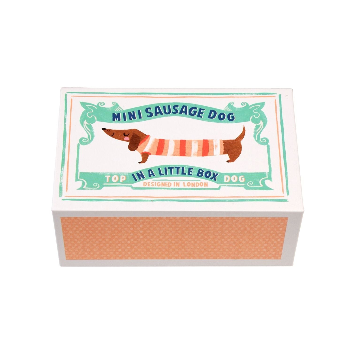 A miniature soft toy of a sausage dog packaged in a box with a striped jumper design on the box lid.