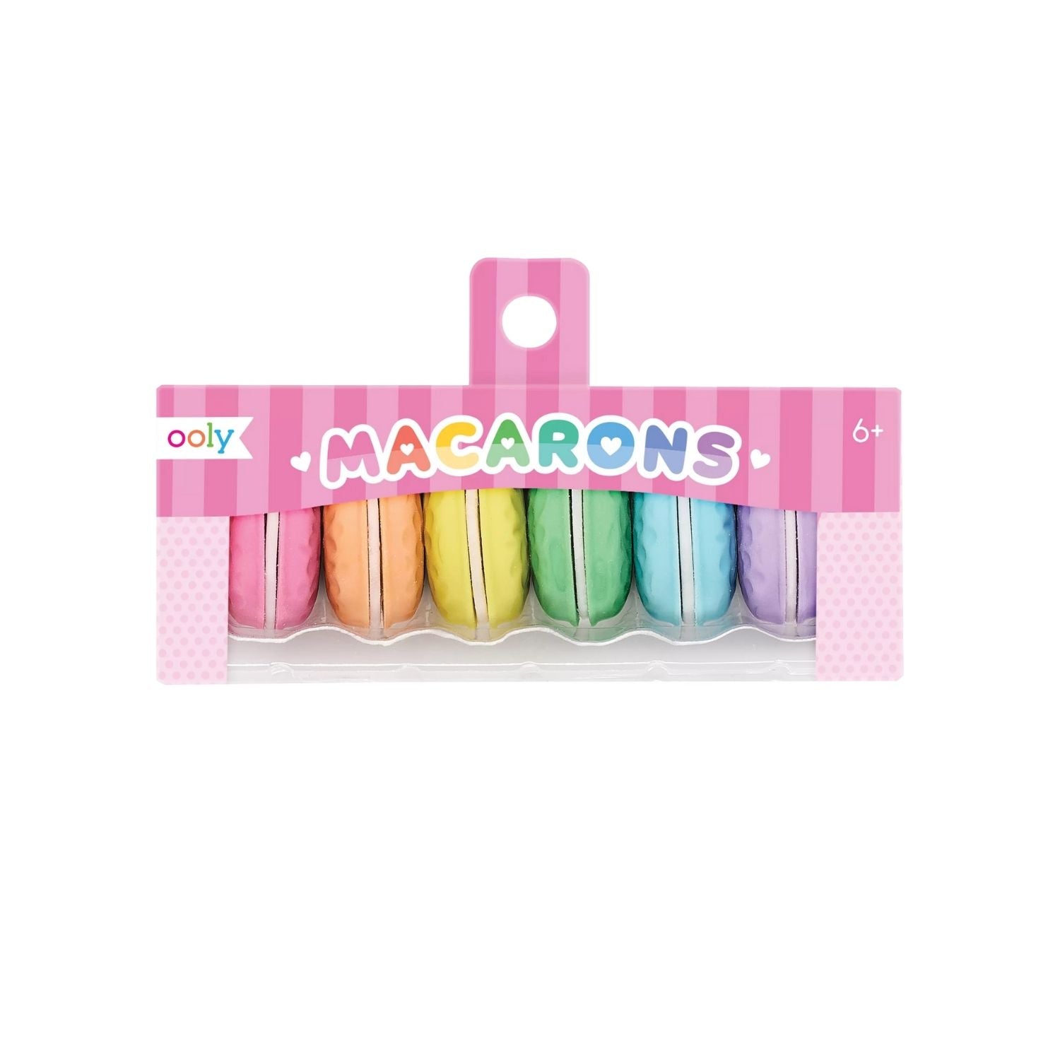 A pack of six multicolored macaron-shaped erasers with vanilla scent, branded by ooly, packaged in a clear plastic box with a pink background.